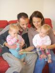 Kieren with Holly and Verity with Bethany reading a book